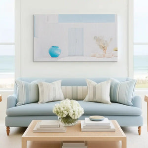 Neutral white and aqua canvas wall art complementing modern coastal décor