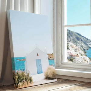 Seaside chapel captured in canvas print with clean minimalist style and sunlit coastal colors
