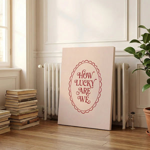 Fine art canvas with minimalist design, featuring warm red words in a scalloped frame against a calm beige tone