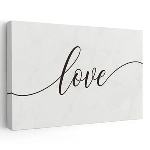 Elegant canvas wall art featuring the word 'love' in flowing black cursive on a clean white background.