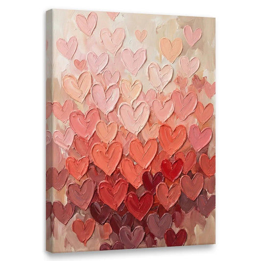 Abstract canvas wall art featuring layered heart shapes in red, pink, and peach tones with a textured, painterly finish.
