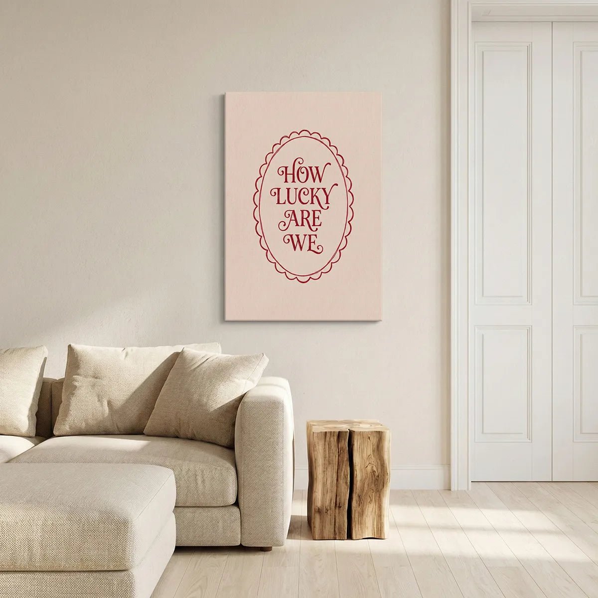 Vintage-inspired canvas wall art with warm red typography framed by a scalloped oval on a muted beige backdrop