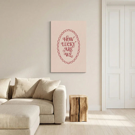 Vintage-inspired canvas wall art with warm red typography framed by a scalloped oval on a muted beige backdrop