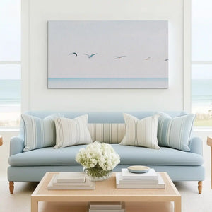 Tranquil ocean horizon canvas art complementing minimalist interiors