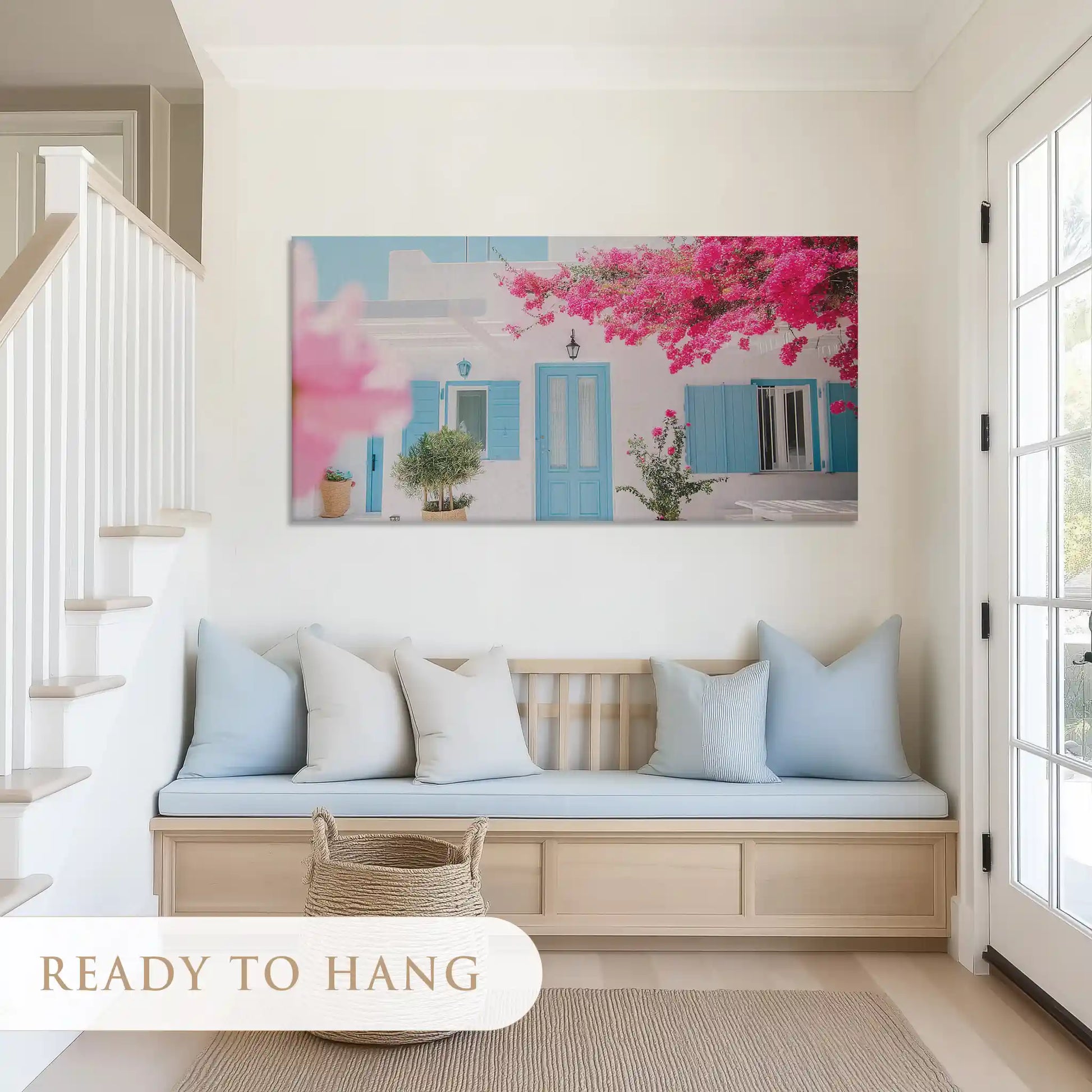 Coastal living room canvas print with pastel blue accents and pink bougainvillea flowers