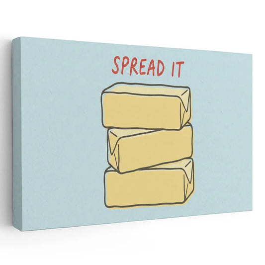 Canvas wall art featuring three stacked yellow butter blocks with bold red text 'SPREAD IT' on a light blue background
