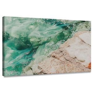 Abstract coastal canvas wall art featuring green ocean waves and sandy shoreline for living room