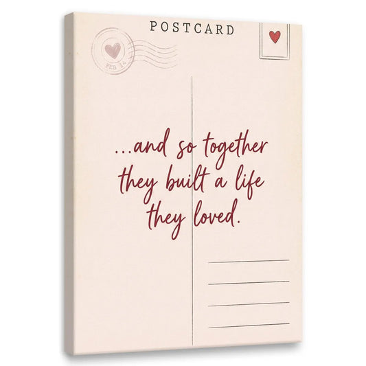 Minimalist canvas wall art featuring a vintage postcard design with a heart, stamp, and the quote '...and so together they built a life they loved.'