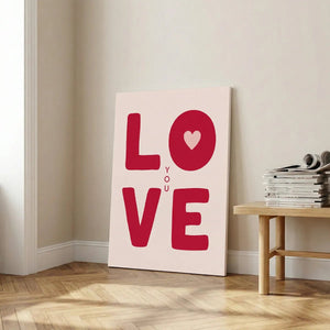 Modern canvas art showcasing graphic red lettering and a heart symbol, combining minimalist and pop art styles