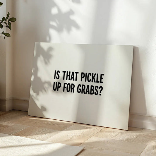 Minimalist canvas wall art featuring centered black typography on a white background with the phrase 'IS THAT PICKLE UP FOR GRABS?'