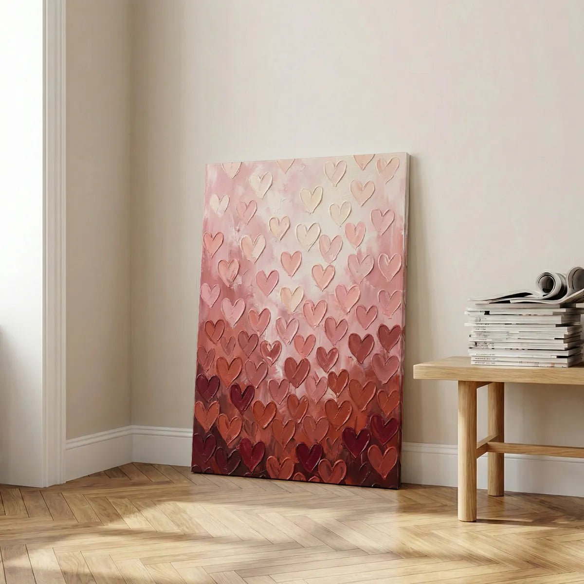 Stylized canvas print showing rows of heart motifs increasing in saturation from top to bottom in a warm color palette