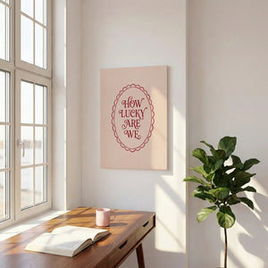 Flat-rendered canvas print showing affectionate red lettering within a decorative oval border on a light neutral background