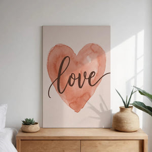 Canvas wall art print with a centered heart in muted pink hues and cursive text, combining minimalist and romantic styles.