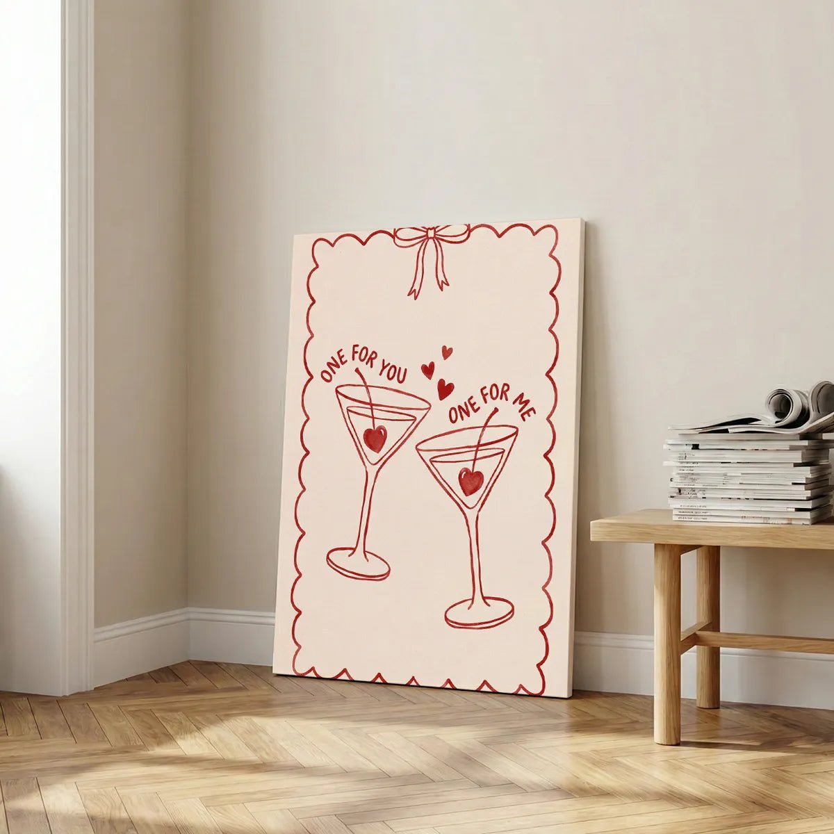 Decorative canvas print with centered illustration of romantic cocktails, heart accents, and a bow-topped frame in soft tones.