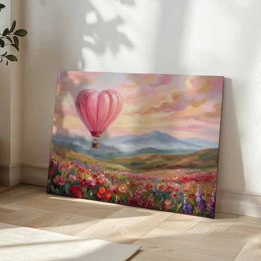 Whimsical canvas wall art of a heart balloon soaring over a vibrant floral field with dreamy mountains and a soft pastel sky.
