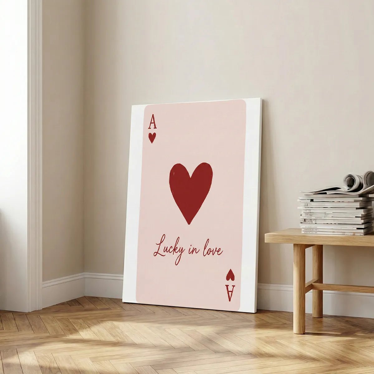 Pop art-inspired canvas print showing a red heart symbol and the phrase 'Lucky in love' in clean, modern typography.