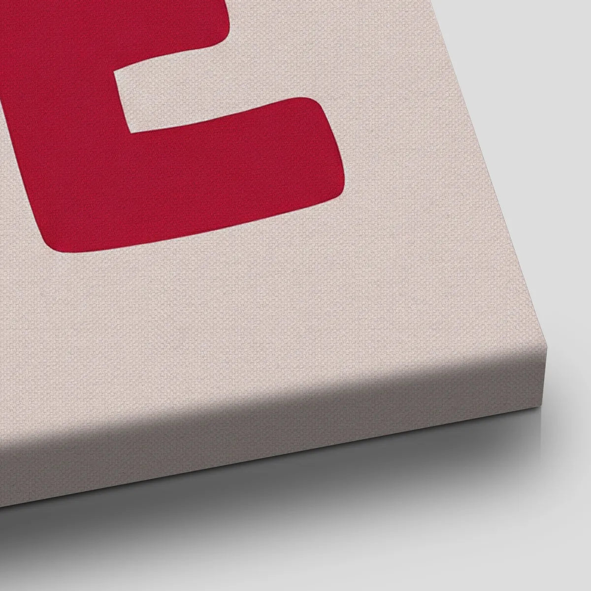 Vertical canvas art with minimalist red typography spelling LOVE and YOU arranged between the letters, suited for romantic spaces