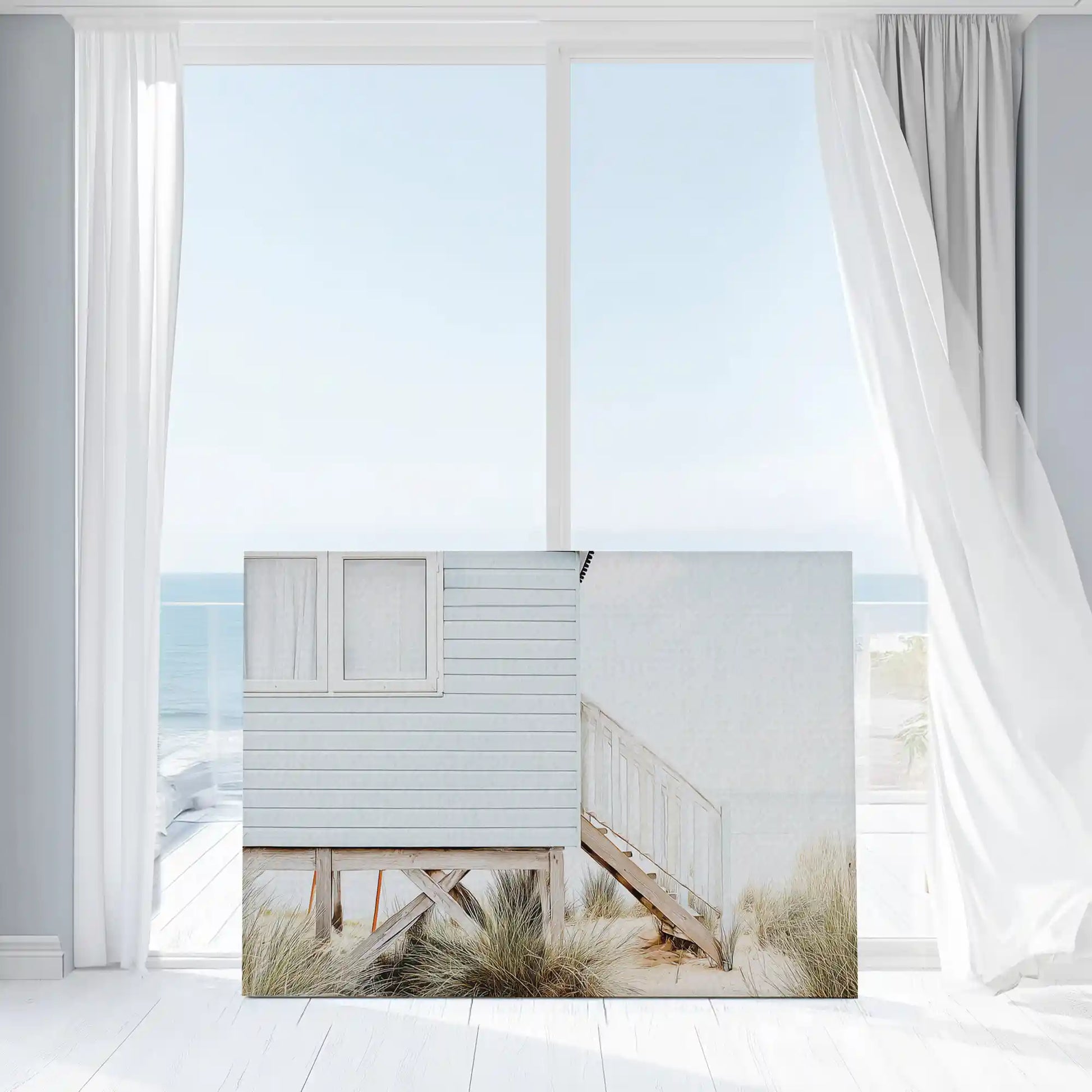 Seaside cabin painting captured in canvas art with natural coastal style