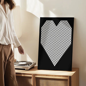 Canvas wall art print of a geometric heart with polka dots, designed in a clean pop art style for modern decor settings