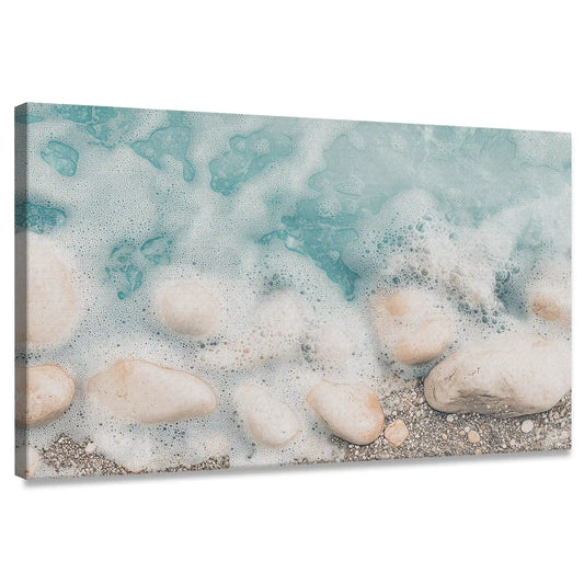 Turquoise coastal canvas wall art with foamy waves over sandy rocks for living room décor