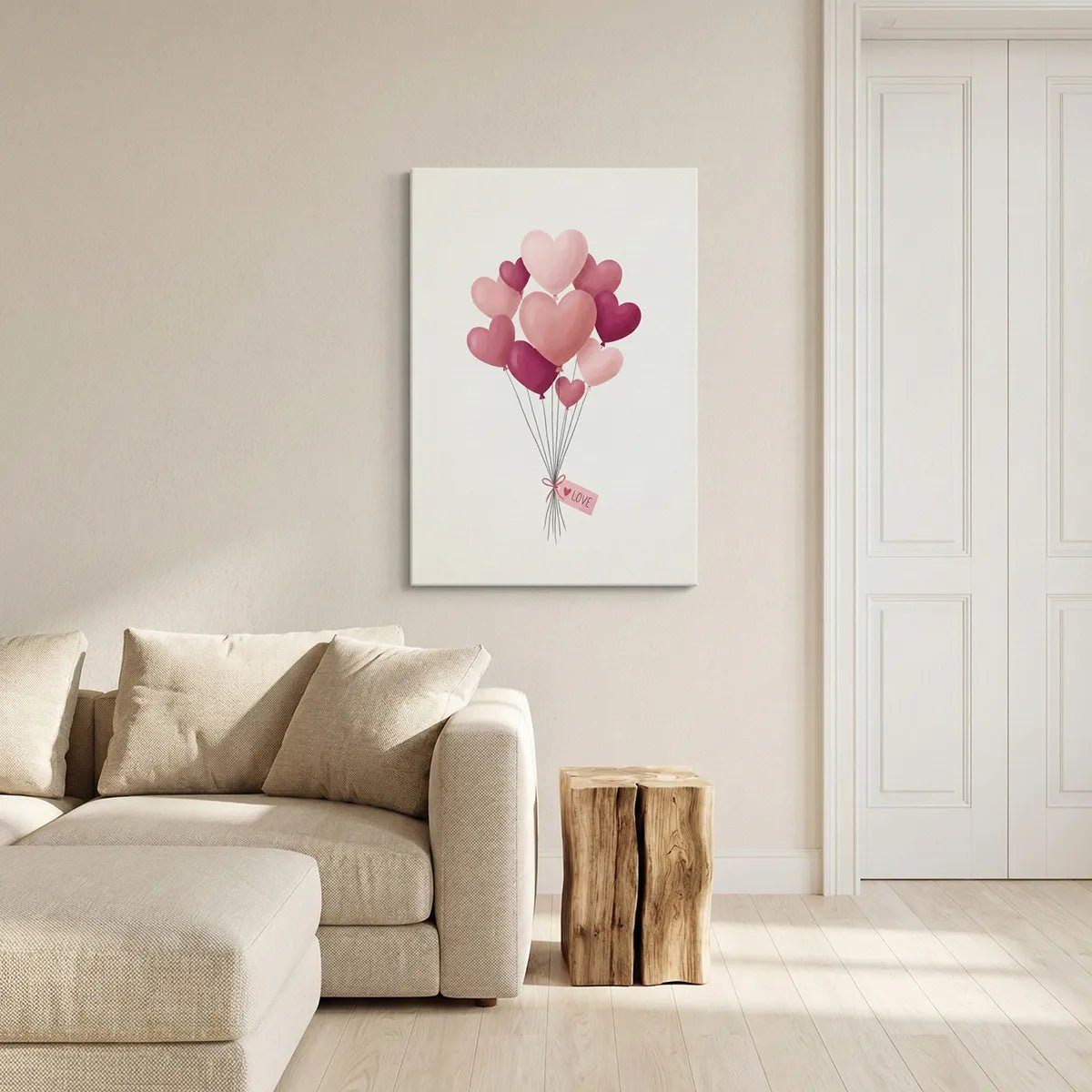Playful canvas wall decor of heart-shaped balloons in a centralized cluster with a soft pink ribbon and white LOVE tag.