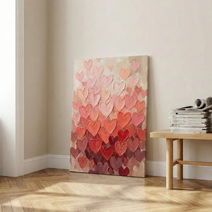 Stylized canvas artwork of layered hearts in varying shades of red and pink, arranged in a vertical, centered layout.