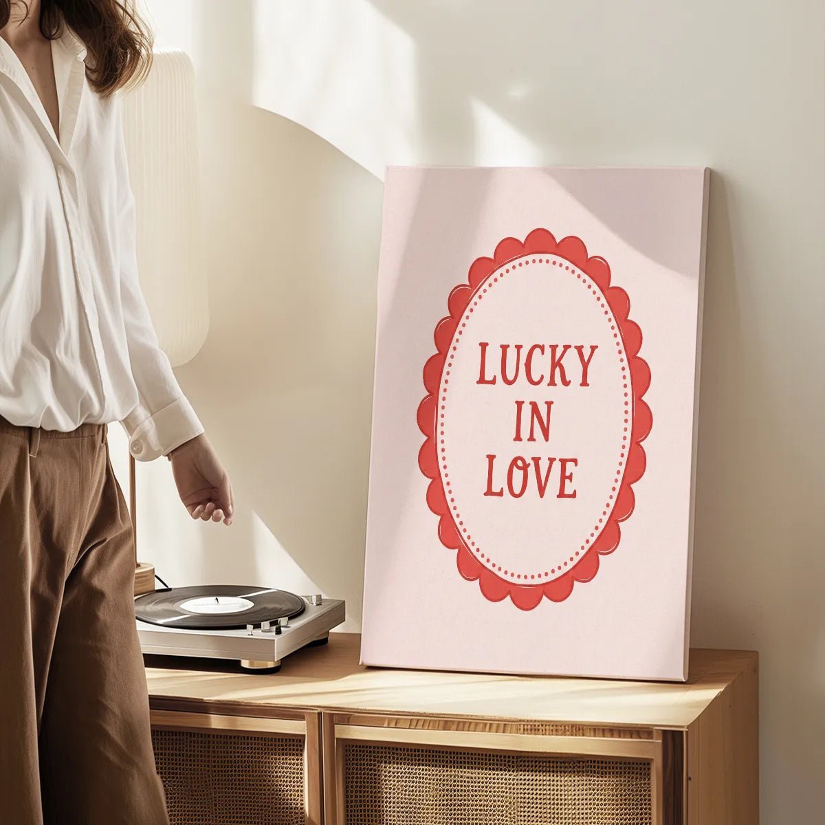 Gallery wrapped canvas showing a minimalist red message framed by a dotted oval, ideal for living room decor