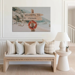 Mediterranean coastal wall art canvas with seaside town and rustic wooden sign design