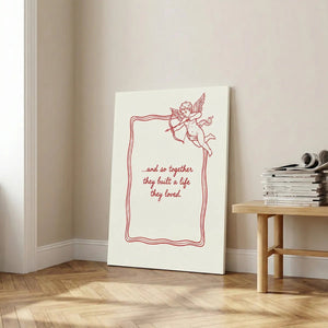Classic canvas wall decor with high-contrast red and off-white palette, featuring a cupid and heartfelt message in script font.