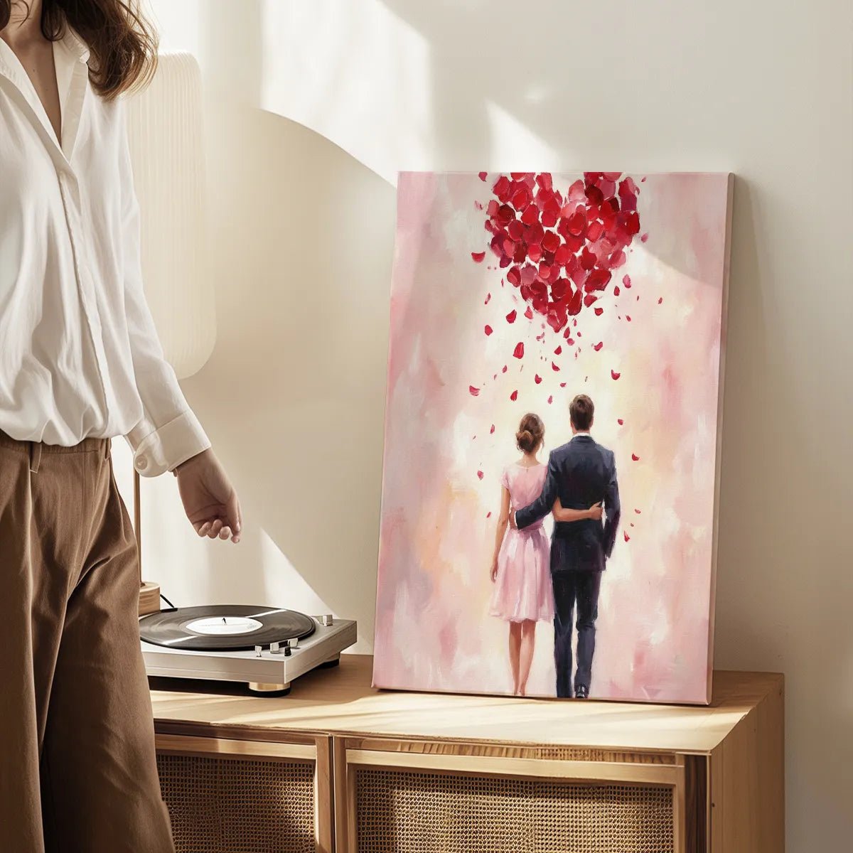 Decorative canvas print featuring a softly blended romantic scene with a couple and a red petal heart, ideal for bedroom decor