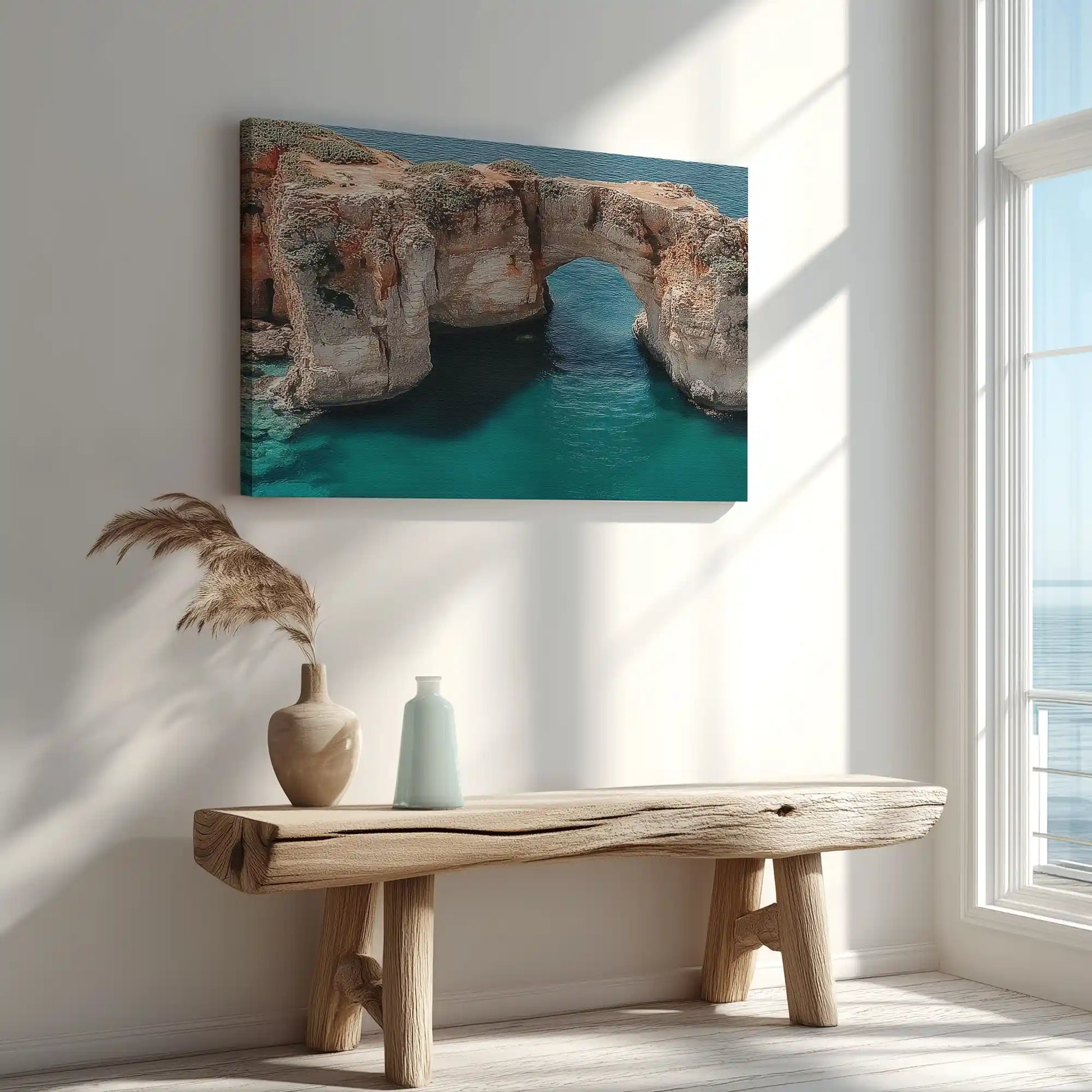 Sunlit archway over turquoise sea captured in canvas print with minimalist coastal style