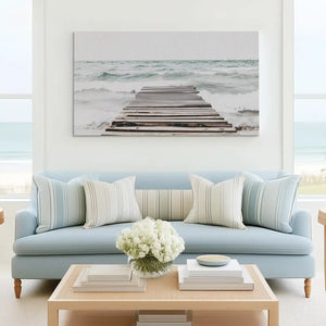 Tranquil dock and sea canvas art complementing minimalist living room decor