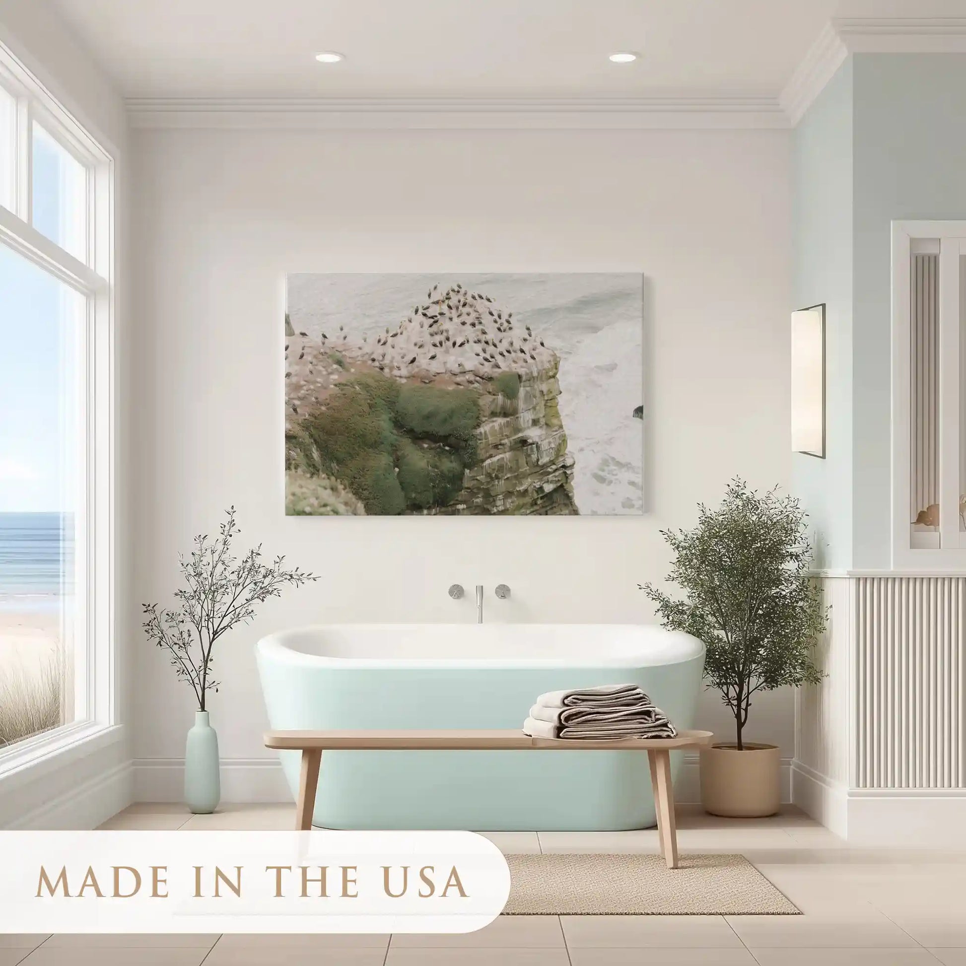Minimalist coastal canvas art of rocky cliffs with natural green and sandy hues