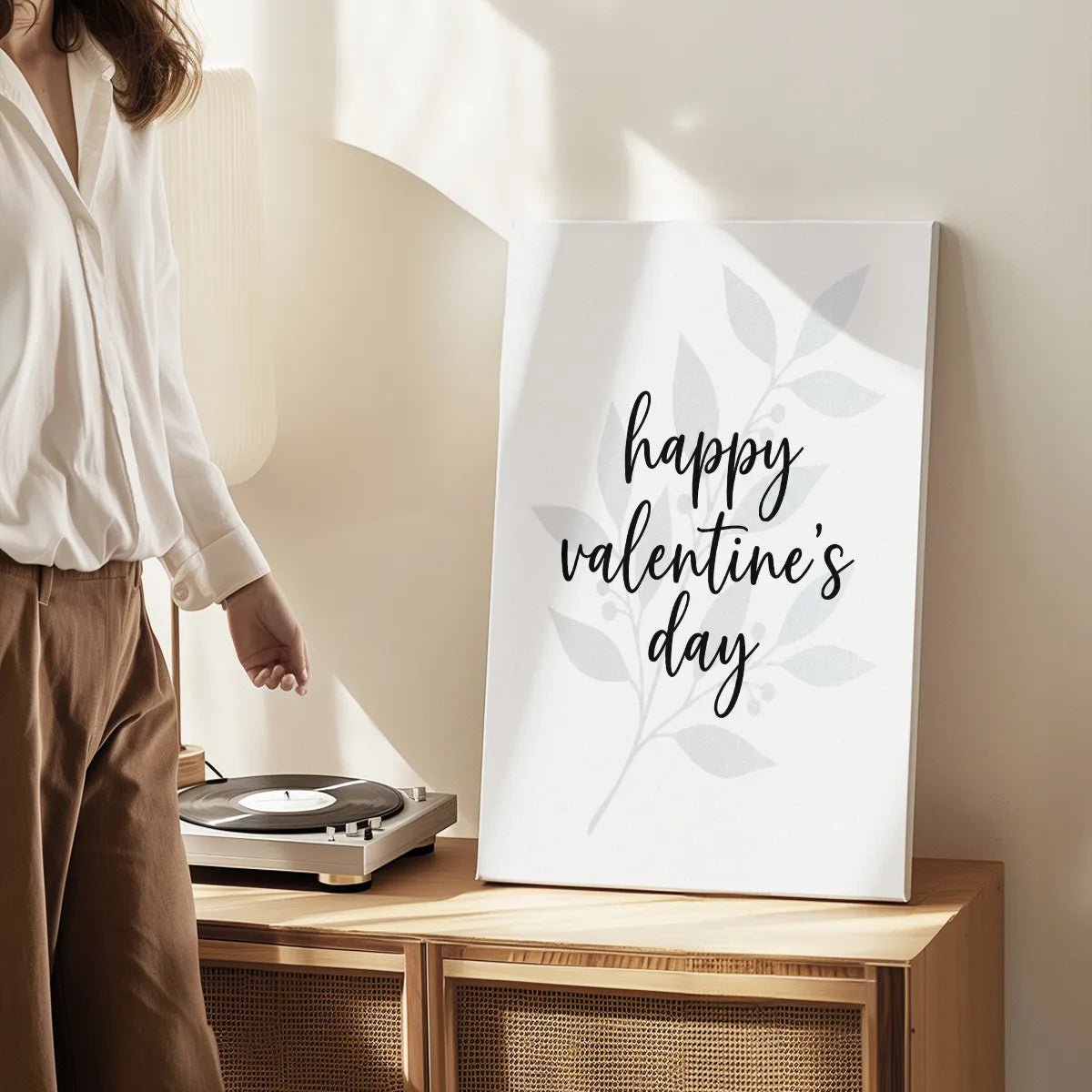 Canvas wall art print with a clean, simple design of romantic script over a light botanical illustration, ideal for minimalist bedrooms