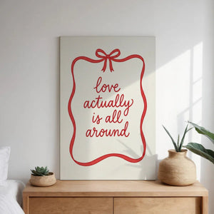 Canvas wall art print with elegant hand-lettered message framed by a red ribbon and bow, ideal for romantic-themed interiors