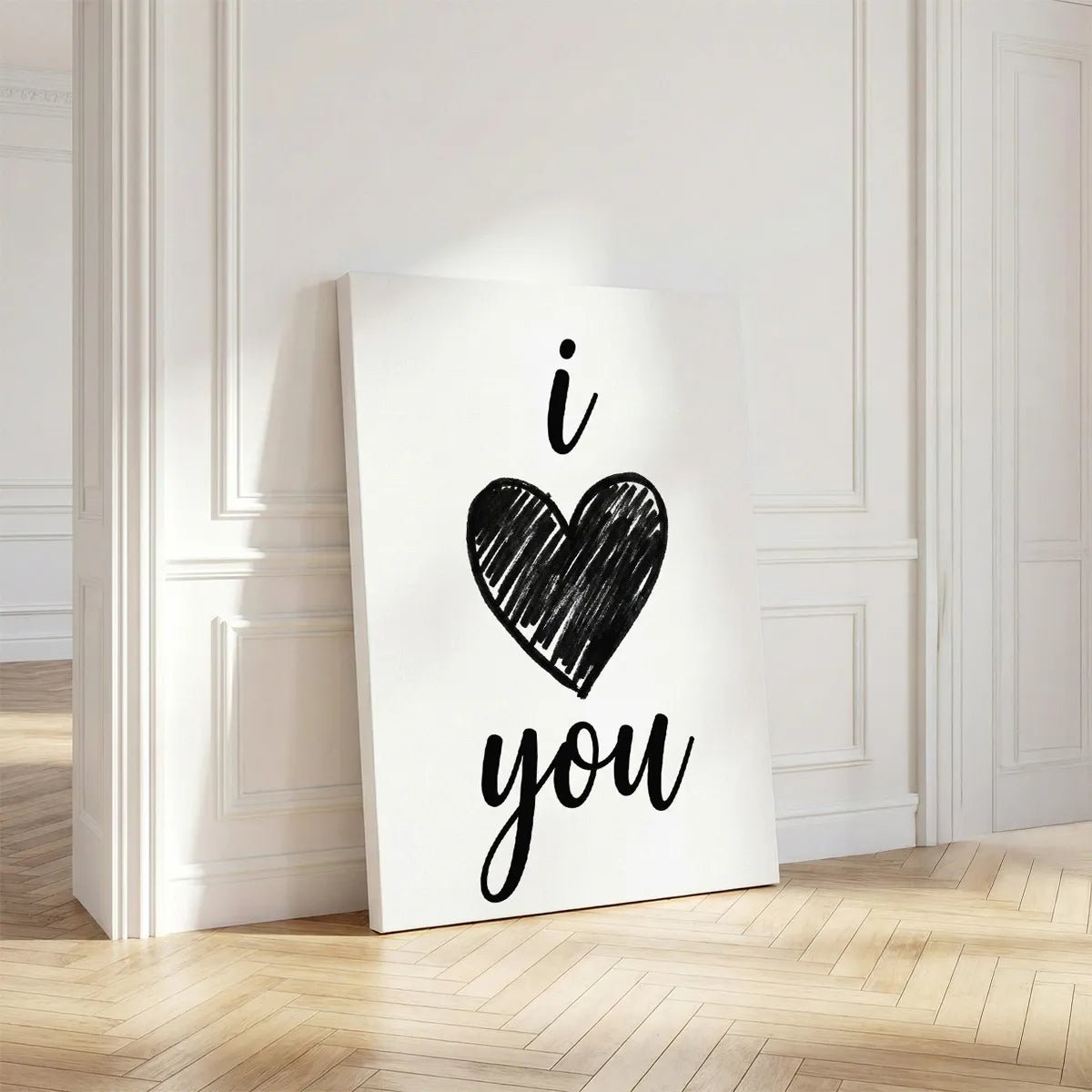 Vertical canvas art featuring a black heart and handwritten 'i' and 'you' text, aligned centrally in a modern romantic style