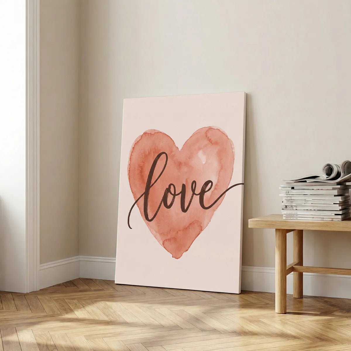 Vertical canvas art with a centered watercolor heart and flowing cursive 'love' text, styled for a modern nursery wall.