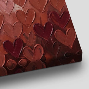Painterly canvas wall decor with thick acrylic hearts in pink and red hues, centered in a vertical composition