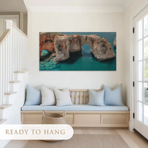 Large nautical cliff canvas art featuring dramatic seaside arch for modern living room walls