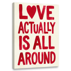 Modern canvas wall art featuring bold red hand-lettered text 'LOVE ACTUALLY IS ALL AROUND' with a heart symbol replacing the 'O'.