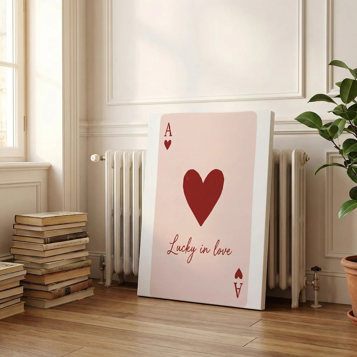 Canvas wall art print featuring a bold heart and letter A above cursive text, styled for modern romantic interiors.