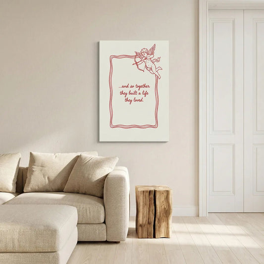 Romantic canvas wall art with vintage-style cupid illustration and centered sentimental quote in red on off-white background.
