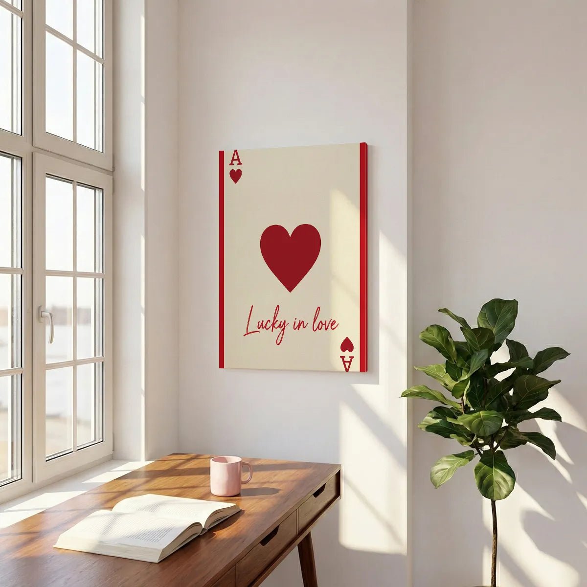 Pop art canvas print showing a stylized playing card design with clean lines, red accents, and romantic typography.
