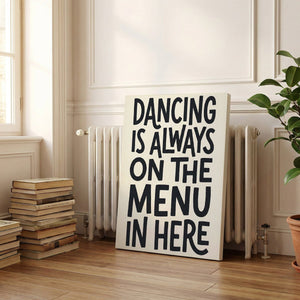 Decorative canvas print with bold graphic text celebrating dance, set against a neutral background for visual clarity.