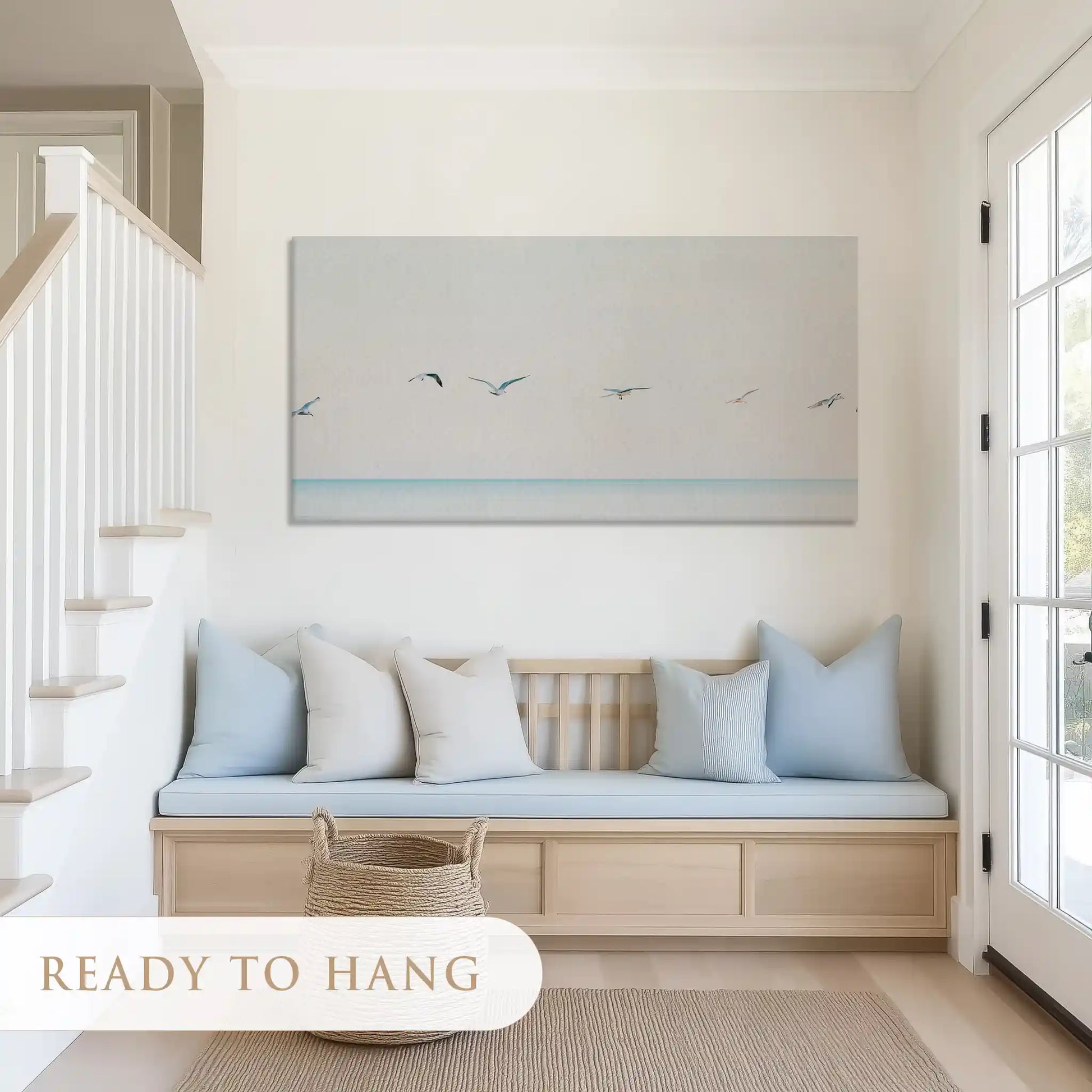 Calming coastal painting with subtle tones creating a serene wall centerpiece