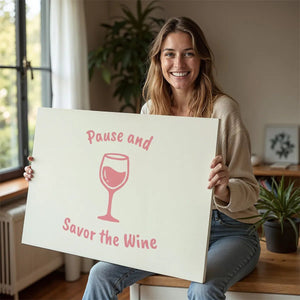 Minimalist canvas wall art with soft pink tones and centered wine glass illustration under curved quote text.
