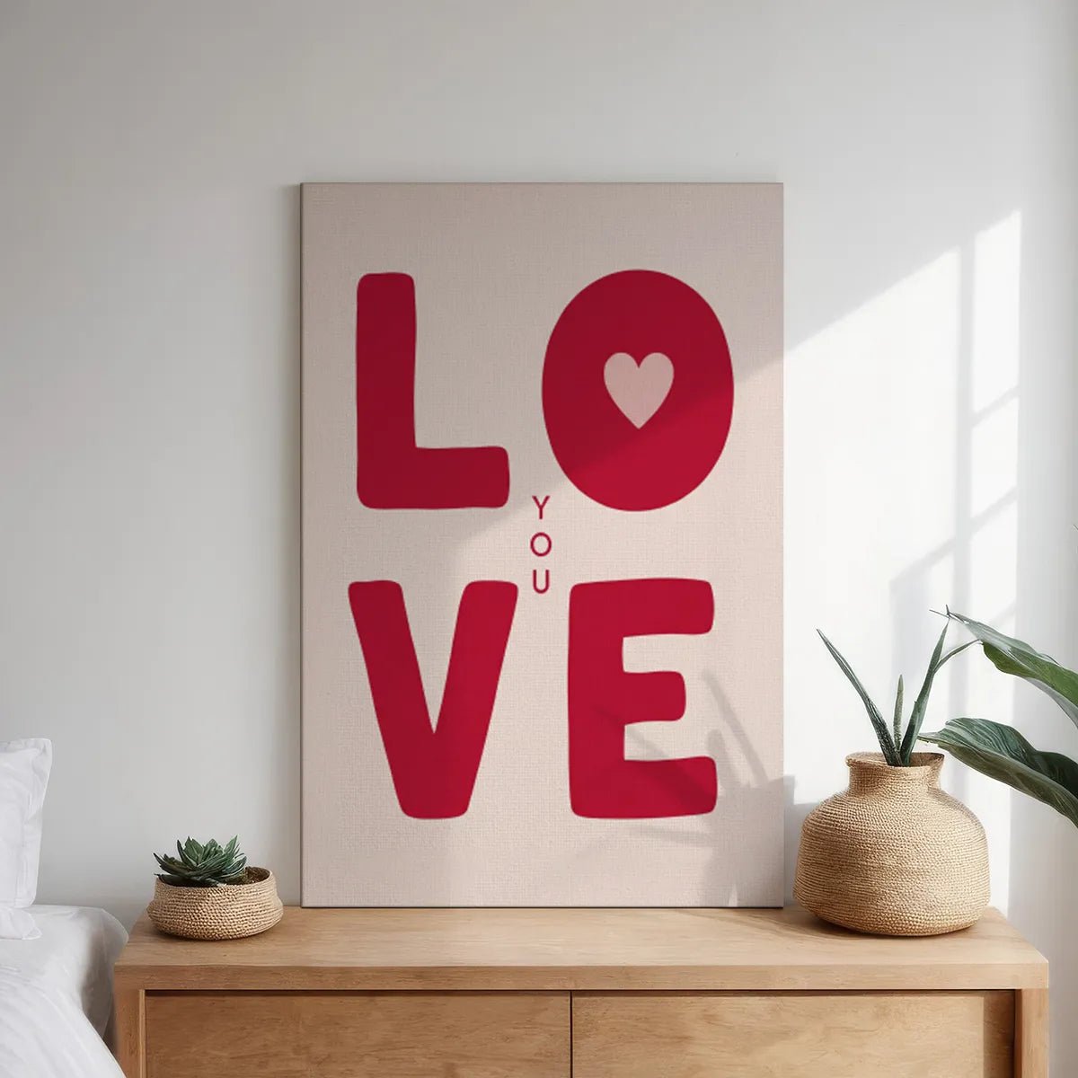 Gallery wrapped canvas featuring centered LOVE typography with a heart in the O and YOU placed vertically in a clean layout