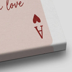 Stylized canvas artwork with a symmetrical heart and A design, accented by cursive script and muted red hues.
