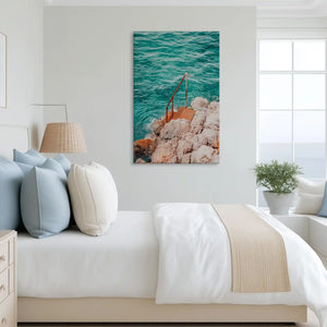 Dynamic ocean rock canvas art complementing minimalist decor with striking coastal tones