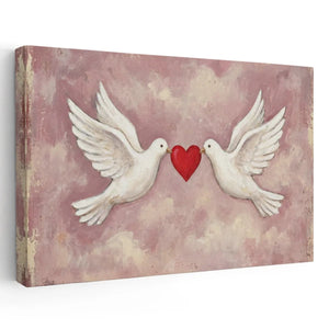 Vintage-style canvas wall art featuring two white doves holding a red heart against a soft pink cloudy background in a romantic setting.